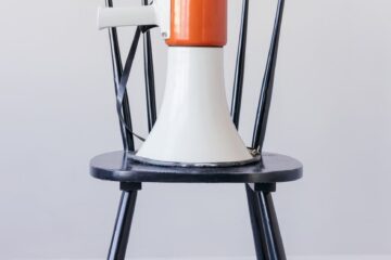 megaphone on top of wooden chair